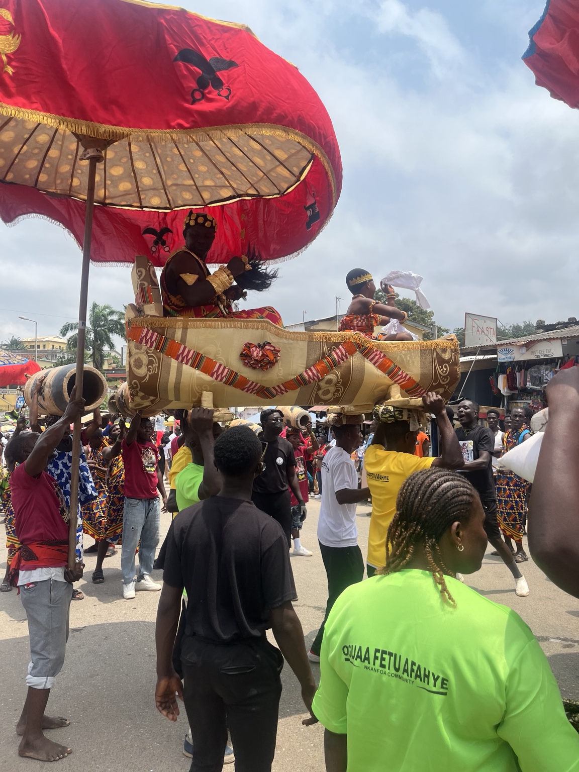 A cultural procession moving through Cape Coast, Ghana